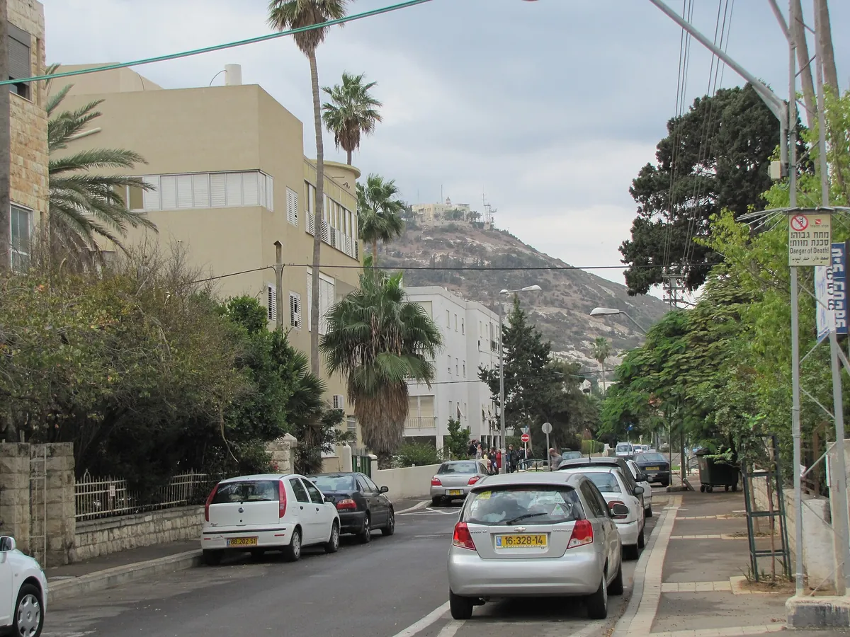 A Bat Galim street with palms, and the Stella Maris monastery on the Carmel headland above