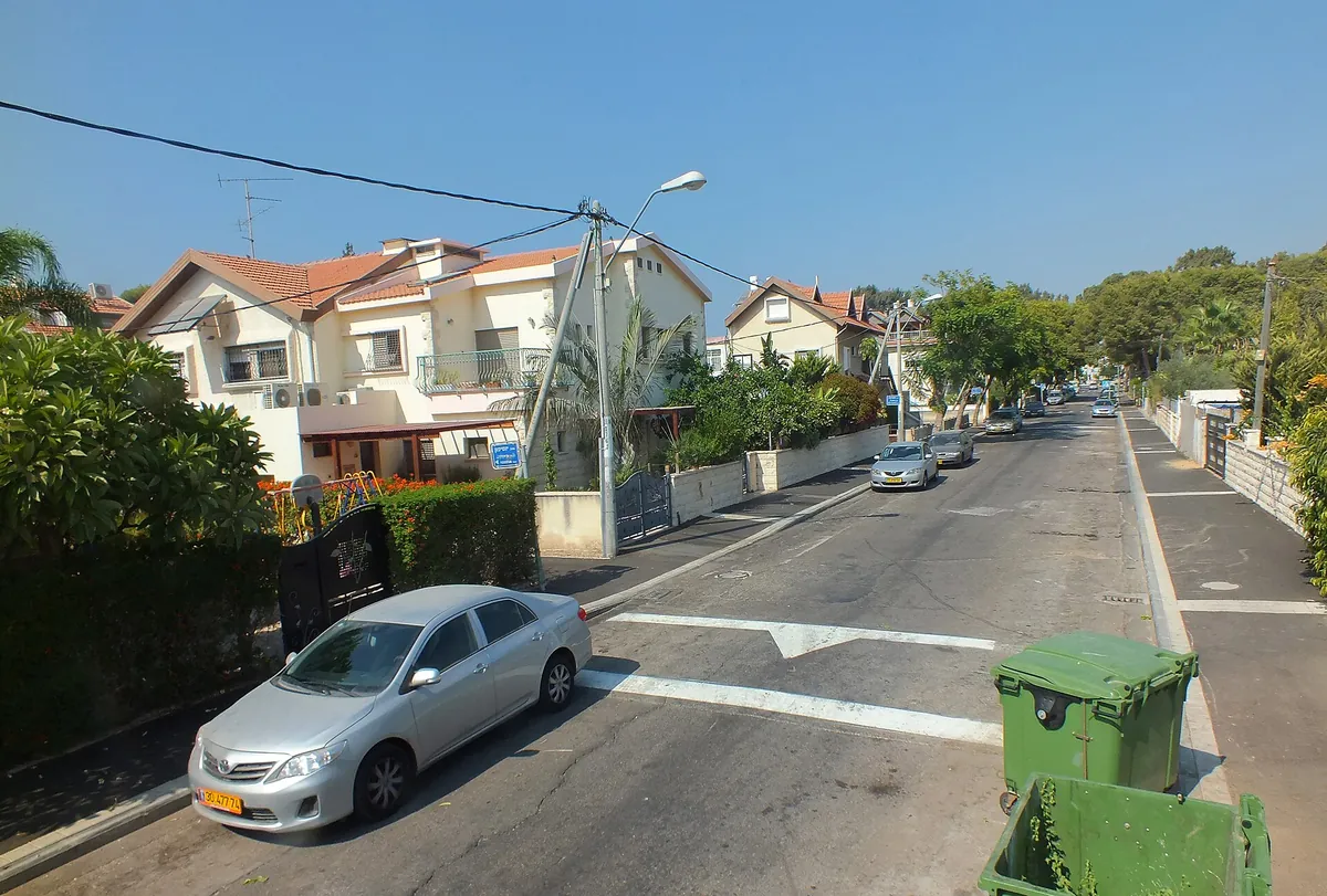 Street of two-storey houses with tiled roofs in Kiryat Shmuel
