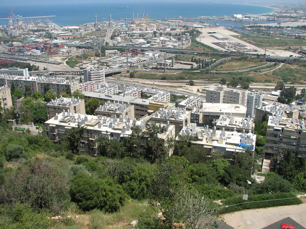 Apartment blocks of Neve Yosef on the slope, with the port and Haifa Bay below